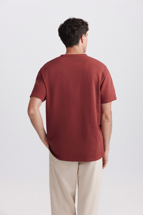 Springfield Playera cuello redondo con botones de piqu&eacute; texturizado naranja