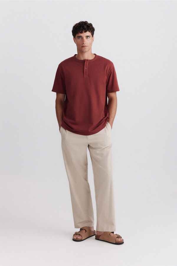 Springfield Playera cuello redondo con botones de piqu&eacute; texturizado naranja